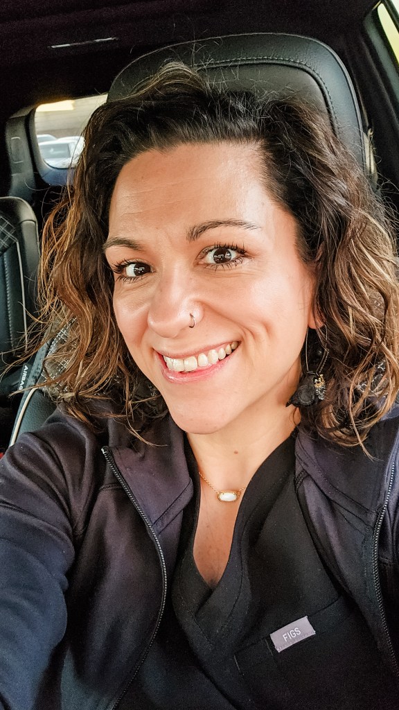 J. Nicole, a Registered Nurse and weight loss expert, smiling in her scrubs. She specializes in medically-supervised metabolic support for women managing PCOS and perimenopause.