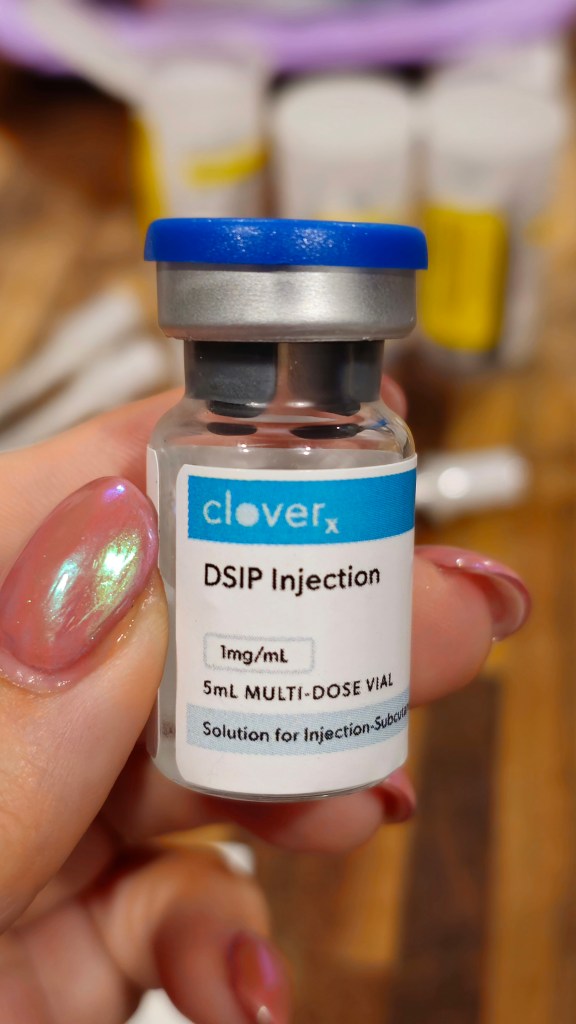 DSIP injection vial with syringes on table - subcutaneous peptide for deep sleep support